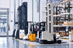 new self propelled lifting platforms in a white warehouse of a factory